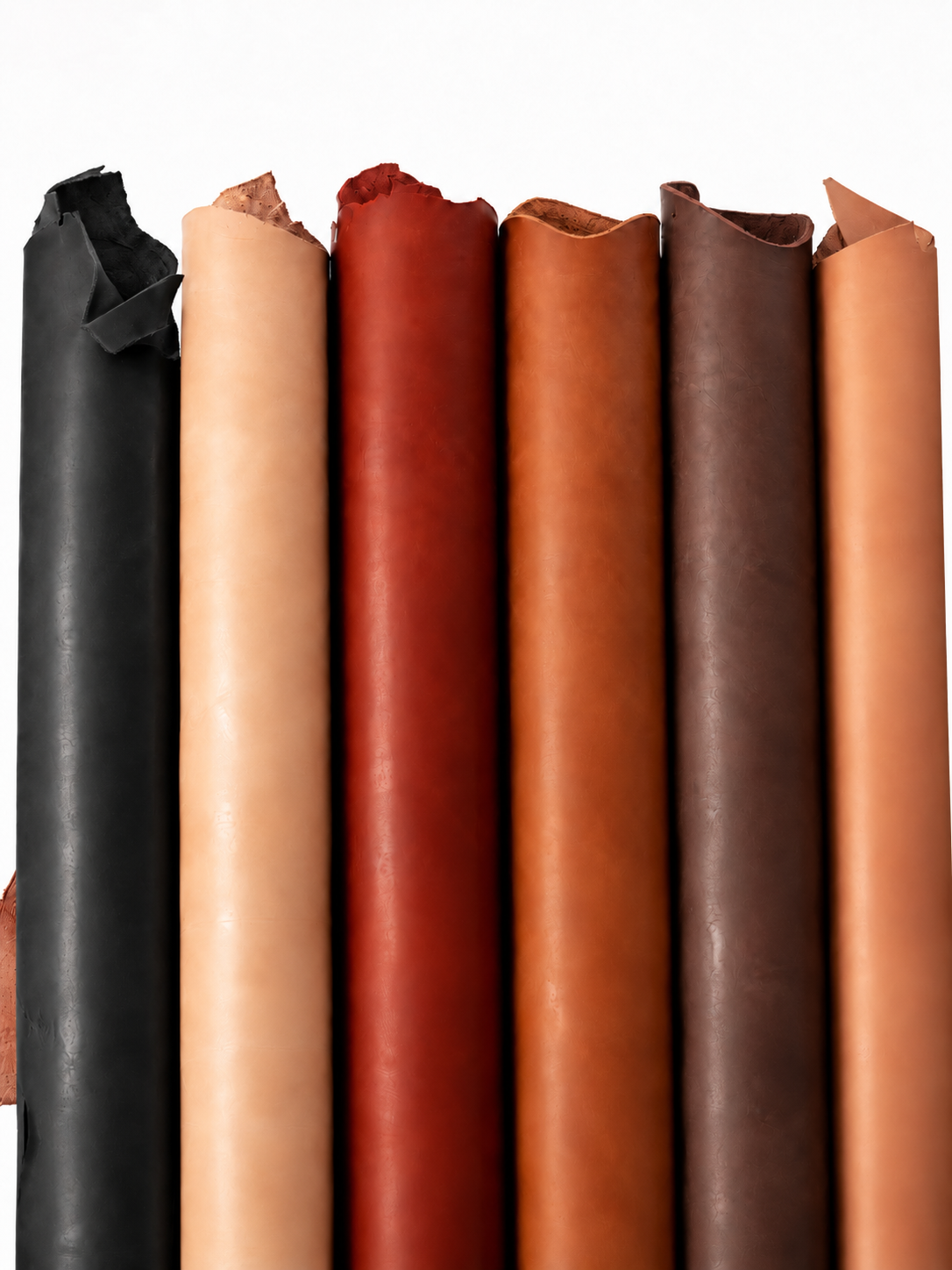 Six rolls of full-grain leather in black, natural tan, terracotta, cognac and chocolate brown